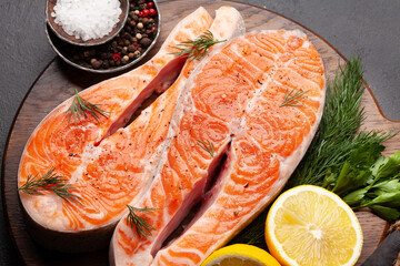 Sticker - Fresh raw salmon cooking. Fish steaks with herbs and spices