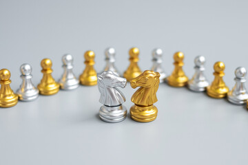 Wall Mural - Gold and silver Chess Knight (horse) figure against pawn. Strategy, Conflict, management, business planning, tactic, politic, communication and leader concept