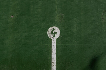 Wall Mural - fronton wall in the Basque ball sport, in which the game marks are painted with the number 4 painted in negative in a white circle on a green background