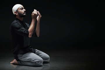 Wall Mural - Religious asian muslim man praying