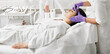 © Peakstock - Attractive woman getting anti-aging injections into face area to remove facial wrinkles at a beauty salon, side view