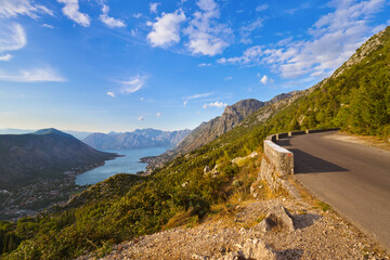 Wall Mural - Mountains road and Kotor Bay on sunset - Montenegro