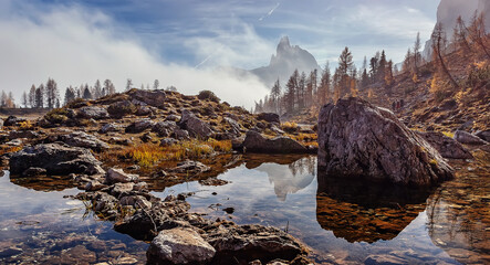 Fotobehang - Stunning foggy morning over the mountain valley in Dolomites alps. Scenic image of Autumn scenery in mountains. Federa lake. Italy. popular touristic place. Best famouse hiking locations.