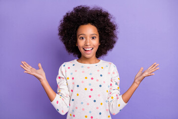 Sticker - Photo of happy amazed small pretty dark skin girl good news reaction isolated on purple color background