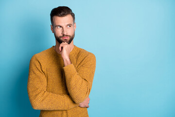 Wall Mural - Photo of young attractive handsome thoughtful man thinking look copyspace hold hand chin isolated on blue color background