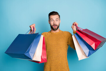 Wall Mural - Photo of young happy excited amazed handsome man sees big sale disocunt isolated on blue color background