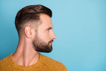 Wall Mural - Profile side photo of young attractive handsome serious man looking copyspace isolated on blue color background