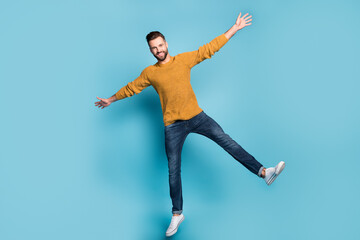 Sticker - Full length body size view of nice attractive cheerful guy jumping like star having fun isolated on bright blue color background