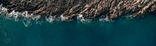 Wild Ocean Water From Above - Waves Hitting The Rocks - Aerial Photography