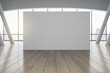 Grey partition with copyspace in sunny empty hall with grey columns, wooden floor and city view. 3D rendering, mockup