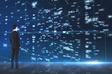 Wall Mural - Analytics concept with businessman looking at media wall with stats data indicator