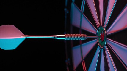 Poster - One dart hits the center of the dartboard. Slow flight of a dart into the bull's eye. 