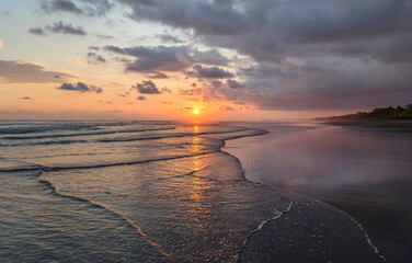 Wall Mural - Beautiful sunset sky on the beach in Matapalo, Costa Rica. Central America. Sky background on sunset. Tropical sea.