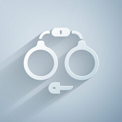 Sticker - Paper cut Handcuffs icon isolated on grey background. Paper art style. Vector