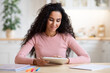 © Prostock-studio - Modern Technologies Concept. Portrait Of Smiling Woman Using Digital Tablet In Kitchen