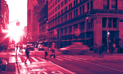 New York City street scene with crowds of people and cars in a busy intersection on Fifth Avenue in Manhattan with colorful pink and blue duotone effect