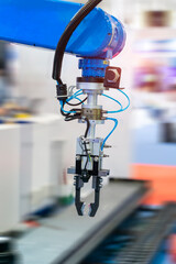 Sticker - Automatic robot in a smart factory. Assembly line