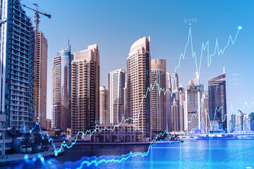 Wall Mural - Skyscrapers of Dubai business downtown. International hub of trading and financial services of Western Asia. FOREX graph and chart concept. Double exposure. Dubai Canal waterfront.