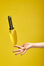 Small Scoop Or Shovel Isolated On Yellow Background