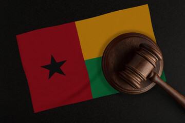 Judges gavel and the flag of Guinea. Law and Justice. Constitutional law