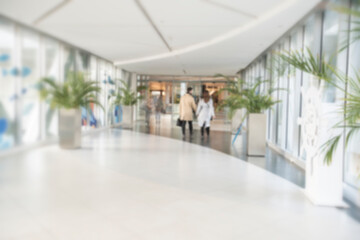 Abstract blur shopping mall corridor. Blurred retail and hall interior in department store. Defocused bokeh effect background or backdrop for business concept. High quality photo