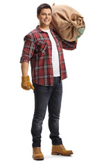 Poster - Full length portrait of a young farmer carrying a burlap sack on his shoulder