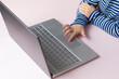 © Elena - Little child's fingers touch on notebook. Self isolation. Home schooling