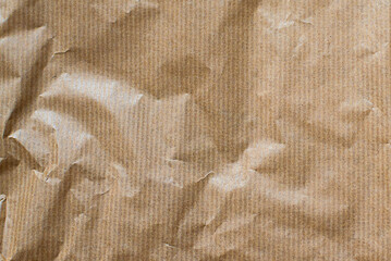 Kraft paper crumpled texture vertical striped pattern for wrapping. Kraft paper texture background.