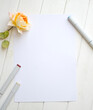 Mockup for A4 paper with single rose and drawing material