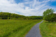 © Liz Albro Photos - A gravel covered path lines a grassy field and leads into the foothills of the Shenandoah Mountains.
