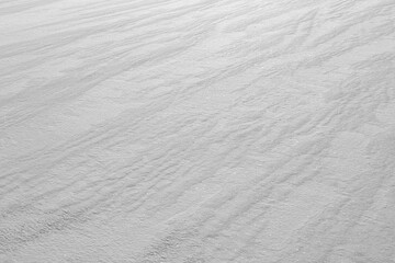 Wall Mural - faint parallel line patterns in pure windswept white snow