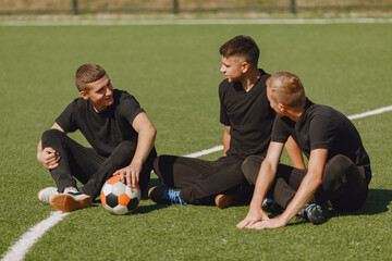 Wall Mural - Spormen is playing football and practising with the ball