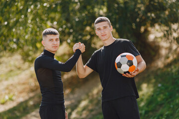 Wall Mural - Spormen is playing football and practising with the ball