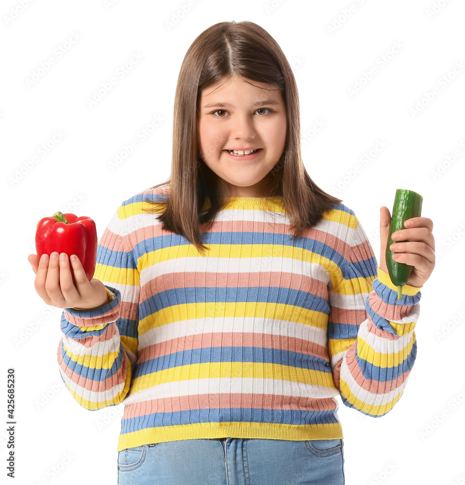 Overweight girl with healthy vegetables on white background
