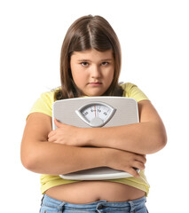 Wall Mural - Sad overweight girl with measuring scales on white background