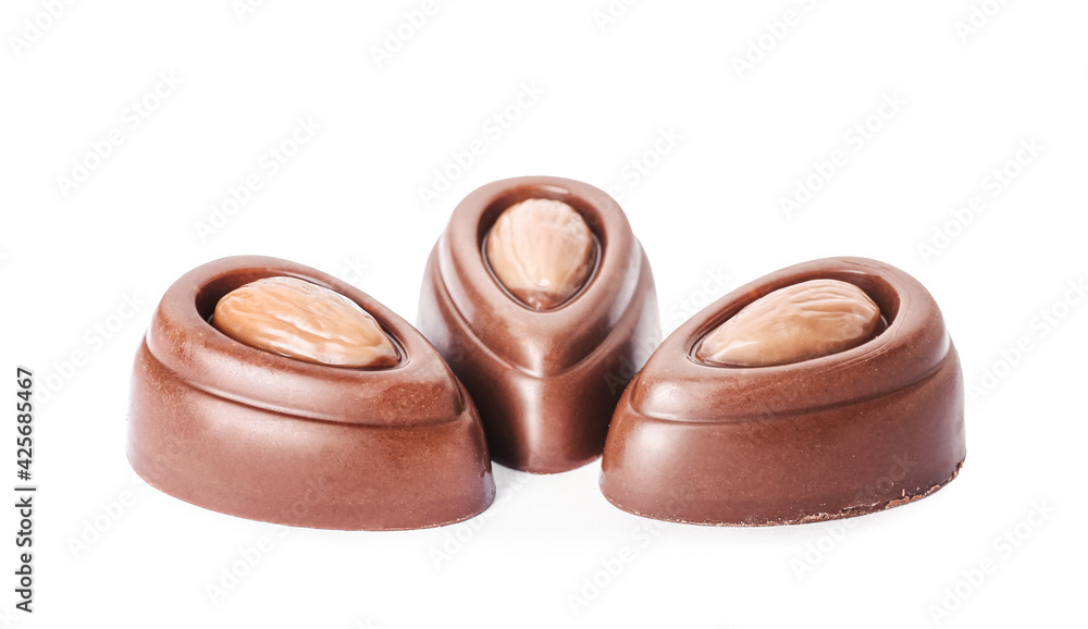 Tasty chocolate candies on white background