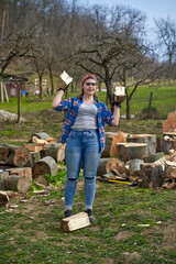 Canvas Print - Woman farmer splitting wood