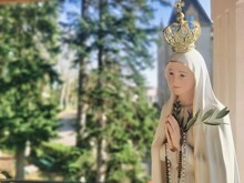 Virgin Mary Statue Praying With Her Hands Joined ,with A Crown. Our Lady Of Fatima. Paray-le-Monial, France.