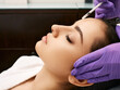 © Peakstock - Botulinum toxin injections to beautiful woman's forehead, side view. Anti-aging procedure after 30 years, cosmetologist doing beauty injection