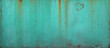 turquoise blue wall or surface of a fence of metal, with orange grooves from rust - weathered texture for the background of a steampunk wallpaper