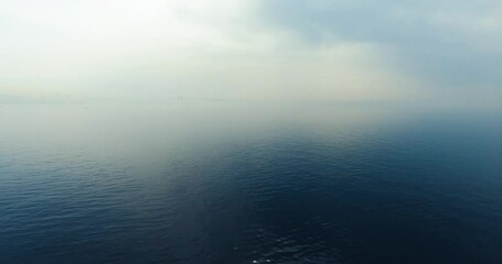 Wall Mural - sea texture view from drone shot in foggy day