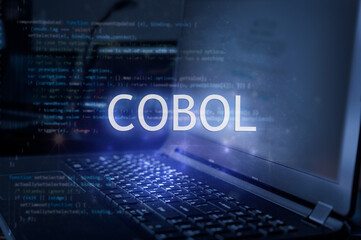 Wall Mural - cobol inscription against laptop and code background. technology concept.