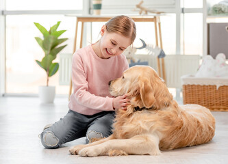 Sticker - Little girl with golden retriever dog