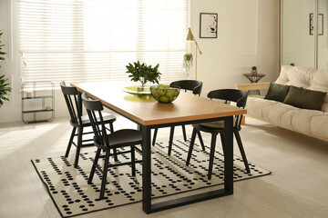 Poster - Stylish wooden dining table and chairs in room. Interior design