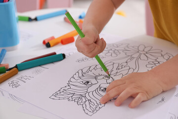 Poster - Child coloring drawing at table in room, closeup