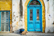 Facade of typical Cypriot house with shabby ruin windows and doors in town of Nicosia , Cyprus