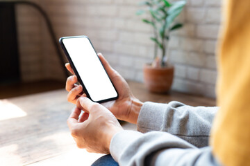 cell phone blank white screen mockup.woman hand holding texting using mobile on desk at office.background empty space for advertise.work people contact marketing business,technology