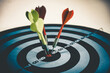 © czchampz - Close up shot of the dart arrow hit on bulleyes of dartboard to represent that the business reached the target of company with dark tone picture style. Target and goal as concept.
