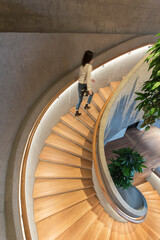 Poster - Modern interior view of spiral staircase, viewed from top