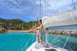 © lo-chef - two young attractive girls in swimsuit partying dancing in sailboat desk